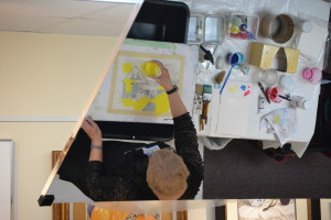 Sandy is starting her first pour on a painting on Tuesday evening. In her studio, she often works on several paintings simultaneously. The painting must be thoroughly dry before any subsequent pours.